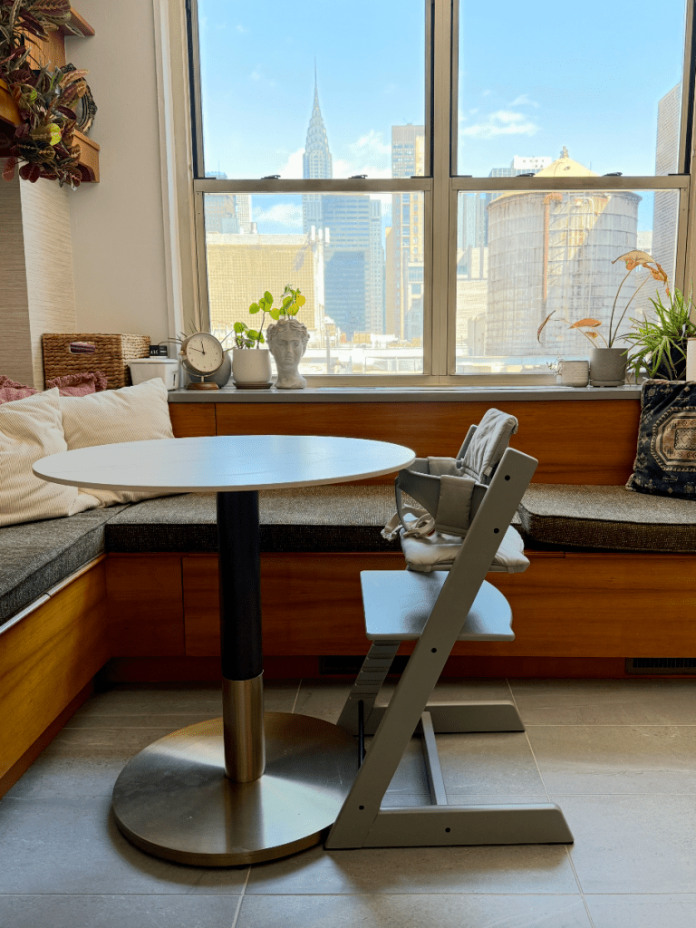 Side view of Stokke Tripp Trapp high chair in Glacier Green in a New York City kitchen